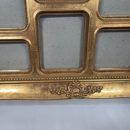 This is an ornate gold-colored resin collage picture frame