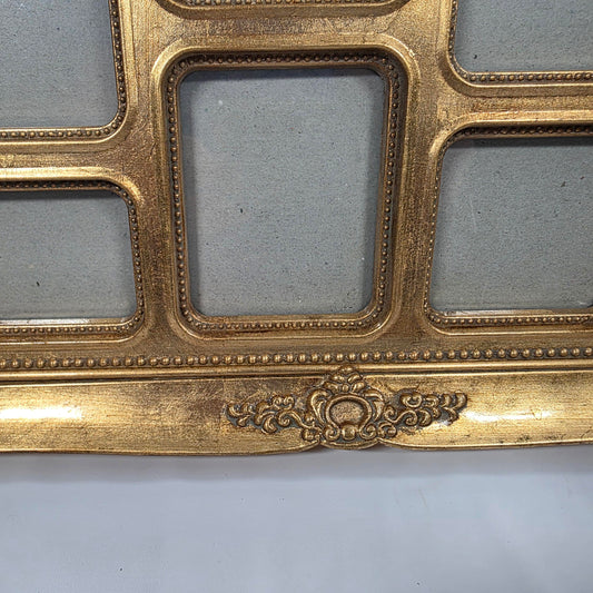 This is an ornate gold-colored resin collage picture frame